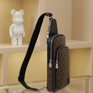 Alternative view of The Avenue Shoulder Bag in Damier Graphite canvas features Louis Vuitton Paris leather appliqué adorning the front exterior pocket. Its adjustable nylon shoulder strap attaches to either side via D-rings, while the canvas shoulder strap and lining uphold sustainable principles.Damier Graphite coated canvas Cowhide leather trim Fabric lining Square metal hardware on front Main compartment Zippered front pocket Small zippered pocket at top Non-removable, adjustable shoulder strap! Dimensions: 20x31x7 cm